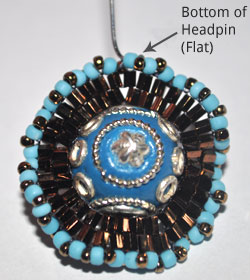 Step 6: Push A Headpin Through A Center Of Blue Seed Bead