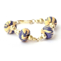 Handmade Bracelet having Purple Beads with Cream Stripes