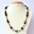 Handmade Necklace with Black Beads having Metal Flower Design