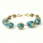 Handmade Bracelet having Blue Beads Studded with Metal Rings
